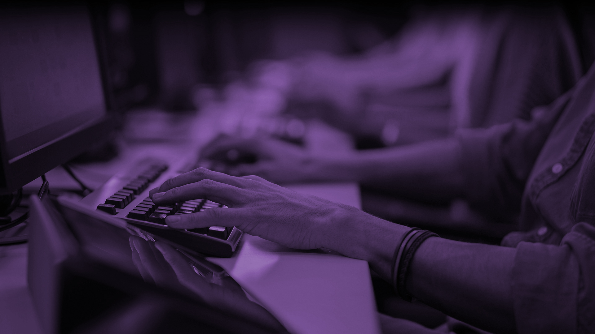 Image of large team using computers inside a 24 hour 364 day customer service department call centre to support the retail bingo industry